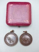 Two Royal Life Saving Society bronze medals awarded to P B Dawson May 1933 and A Flatow June 1929,