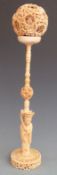 19thC Chinese carved ivory puzzle ball and base diameter 9cm, with inscription 'To AJ Dyer from