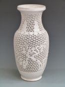 A 19thC Chinese blanc de chine lamp with pierced decoration H41cm