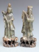 A pair of Chinese carved hardstone figures on pierced bases, H20cm