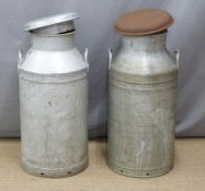 Two aluminium milk churns, one marked Milk Marketing Board, the other Mandee Drys Ltd Newport