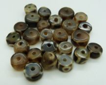Twenty five Tibetan hardstone beads
