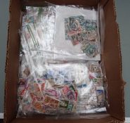 A large quantity of foreign, Commonwealth and GB stamps sorted into packets, all periods