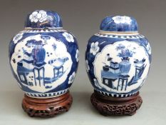 Two Chinese ginger jars and covers, one 19thC, the other 19th/20thC, both on carved hardwood
