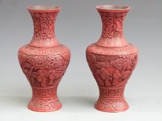 A pair of Chinese cinnabar pedestal vases, label to base Fook Weng and Co, H22cm