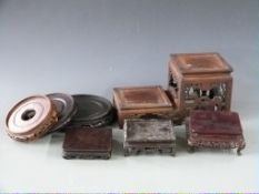 Six 19th/20thC Chinese carved hardwood stands, three circular and three square, largest diameter