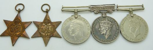 British Army WWII medals comprising 1939/1945 Star, Africa Star, Defence Medal, War Medal and Long