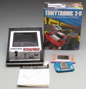 Three video games consoles comprising Nintendo Game & Watch Snoopy Tennis, Tomytronic 3-D Thundering