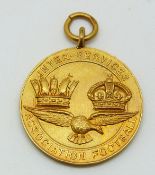 A 9ct gold Inter-service Association Football medal with eagle below two crowns, engraved verso