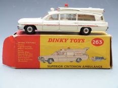 Dinky Toys diecast model Superior Criterion Ambulance with white body, red stripe and light and
