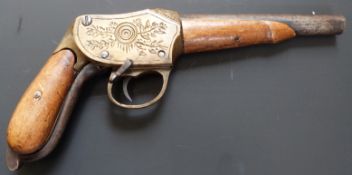 11mm brass framed Martini action pistol with deeply engraved frame, shaped underlever, grips and