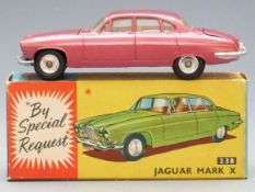 Corgi Toys diecast model Jaguar Mark X with metallic cerise body and lemon interior, 238, in