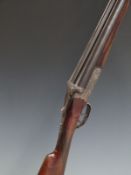 Ugarteburu 12 bore side by side shotgun with engraved lock, trigger guard, underside and top