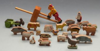 A collection of vintage wooden games including a tinplate trapeze monkey, woodpecker on metal
