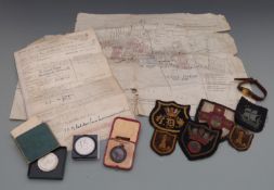 A quantity of military ephemera, badges etc to include Albert Cheetham Royal Navy service record,