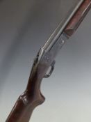 Scout 12 bore single barrelled shotgun with engraved lock, semi-pistol grip, sling suspension