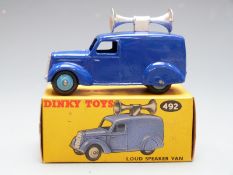 Dinky Toys diecast model Loud Speaker Van with dark blue body, light blue hubs and silver speaker,