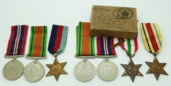 British Forces WWII boxed medals comprising Africa Star with 8th Army bar, Italy Star, Defence Medal