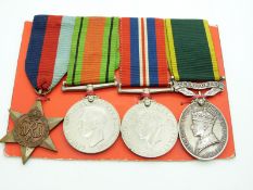 British Army WWII medals comprising 1939/1945 Star, Defence Medal, War Medal and Territorial
