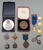 A small collection of commemorative medals / medallions including Army Athletic Association, Royal