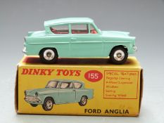 Dinky Toys diecast model Ford Anglia with turquoise body and red interior, 155, in original box.