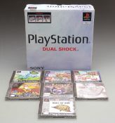 Sony Playstation in original box together with seven games including Rayman, Hogs of War etc.