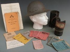 WWII steel helmet marked AMC 1941 and stamped M to rim, together with two gas masks and a quantity