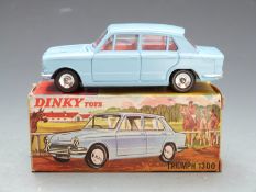 Dinky Toys diecast model Triumph 1300 with pale blue body and red interior, 162, in original box.
