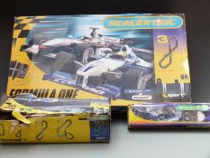 Scalextric Sport Formula One model slot car racing set C1101, Race & Pit Crew C8291, and Track