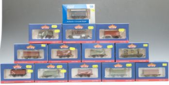 Thirteen Bachmann 00 gauge wagons and good vans, some weathered, all in original boxes.