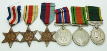 British Army WWII medals comprising 1939/1945 Star, France & Germany Star, Africa Star, Defence