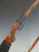 Baikal 12 bore single barrelled shotgun with chequered semi-pistol grip and forend, sling and 29