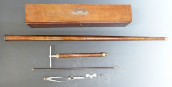 Unnamed metal walking cane air gun with original pump, key and accessories, in felt lined wooden