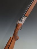 Cased Beretta 692 12 bore over and under ejector shotgun with named matt locks, chequered semi-