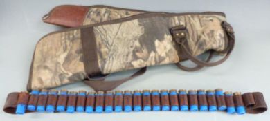 Twenty-four Winchester 12 bore shotgun cartridges together with a Mossy Oak camouflage gun slip.