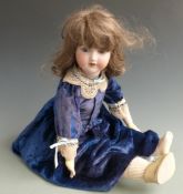 Armand Marseille bisque headed doll with open mouth, weighted blue eyes, brown hair and