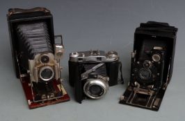 Three vintage folding cameras comprising Houghton Tudor with Beck lens, Contessa Nettel with