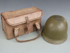 Vietnam era military, possibly M1, helmet and a leather field service kit case marked W.D.