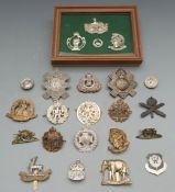 A small collection of cap badges including Rifles, Light Infantry, Machine Gun Corps. etc