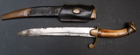 Brass and bone dagger with lion head finial, belt loop and 24cm curved fullered blade, in leather