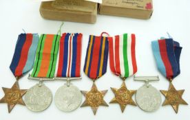 British Forces WWII boxed medals comprising 1939/1945 Star, Burma Star, Defence and War Medals