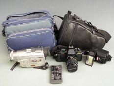 Pentax P30 SLR camera with 1:3.5-4.5 35-70mm lens together with a Panasonic NV-DS150B digital