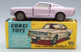 Corgi Toys diecast model Ford Mustang Fastback 2+2 with metallic purple body and cream interior,