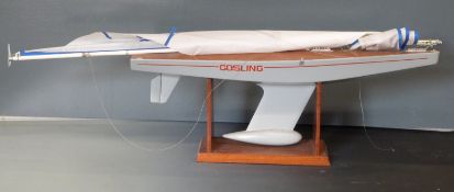 Gosling model pond yacht on mahogany stand, length 92cm.