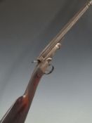 Unnamed .410 hammer action shotgun with chequered grip and 28.5 inch barrel, overall length