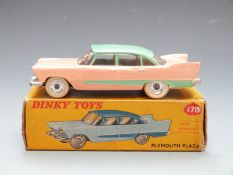 Dinky Toys diecast model Plymouth Plaza with Windows with salmon and green body and cream tyres,