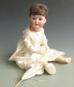 Simon Halbig bisque headed doll with open mouth, fixed blue eyes, brown hair and articulated
