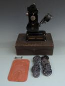 Pathé Baby 9.5mm projector in box with films including Rolling Around and The Collector