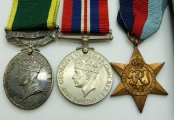 British Army WWII medals comprising 1939/1945 Star, War Medal and Territorial Efficiency Medal named