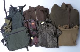 A collection of fishing related clothing ans accessories including waterproof trousers, neoprene